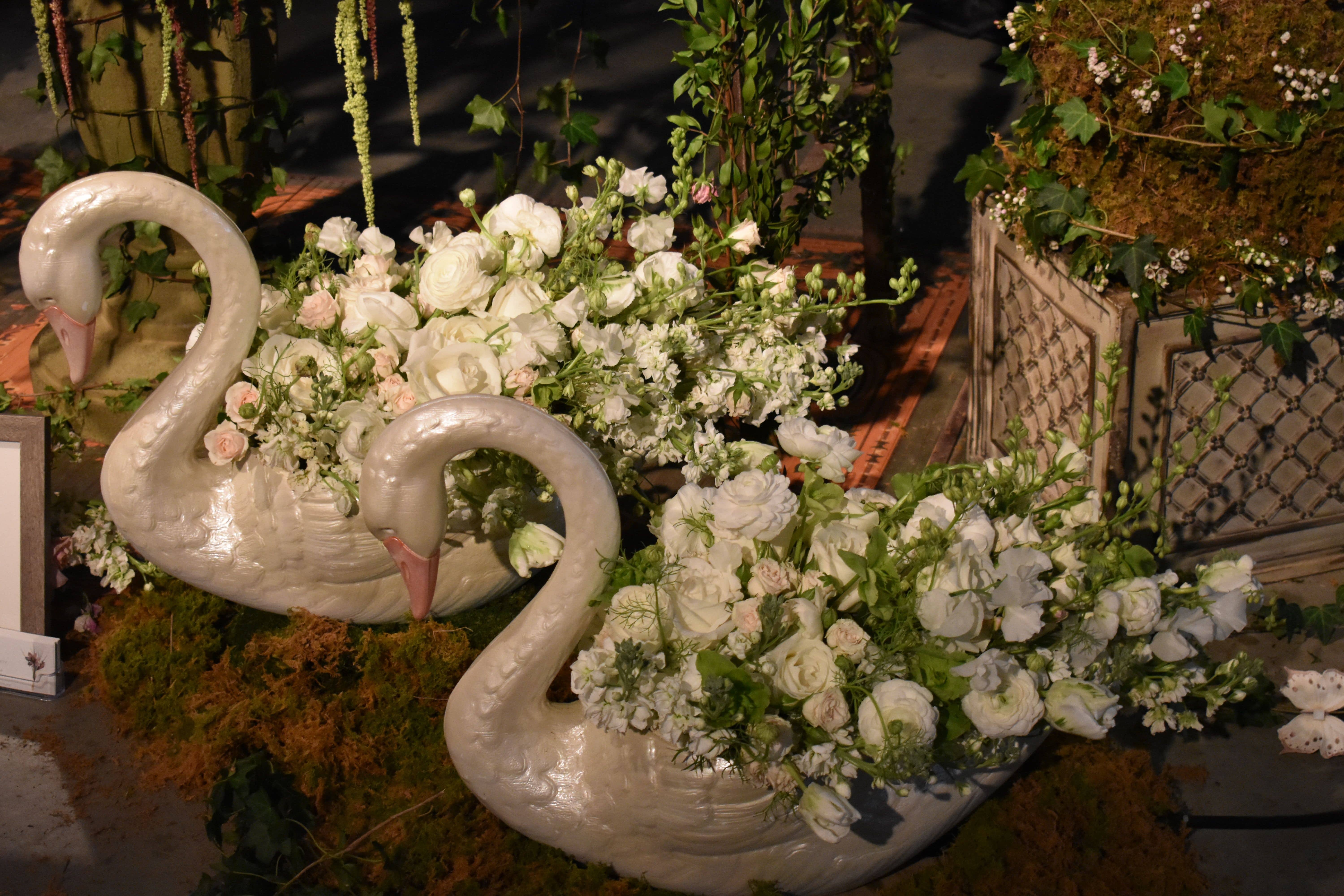 Swan planters with white flowers floral design